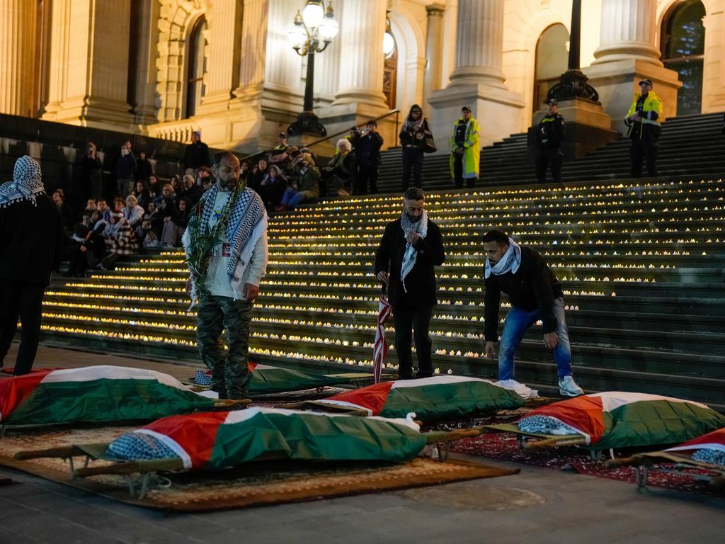 Stretches adorned with the Palestine flag are placed on the steps of the Victorian Parliament. (Photo by Asanka Ratnayake/Getty Images)