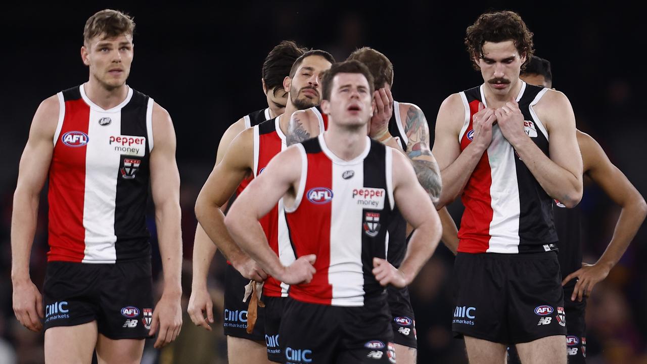 Dejected St Kilda players walk from the ground. Picture: Darrian Traynor