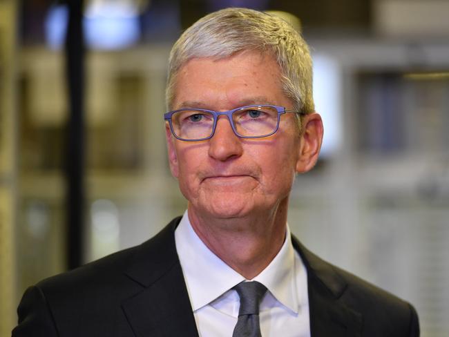 In this file photo taken on November 20, 2019 Apple CEO Tim Cook speak to the press during a tour of the Flextronics computer manufacturing facility, with US President Donald Trump, where Apple's Mac Pros are assembled in Austin, Texas. (Photo by MANDEL NGAN / AFP)