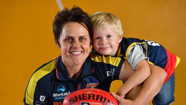 Courtney Gum with her son Buz. Gum is loving life at the Crows after coming out of retirement. Picture: AAP/Keryn Stevens