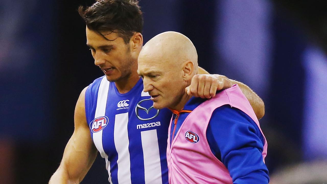 MELBOURNE, AUSTRALIA - APRIL 17: Robbie Tarrant of the Kangaroos comes off the ground injured during the Round 4 AFL match between North Melbourne v Fremantle at Etihad Stadium on April 17, 2016 in Melbourne, Australia. (Photo by Michael Dodge/Getty Images)