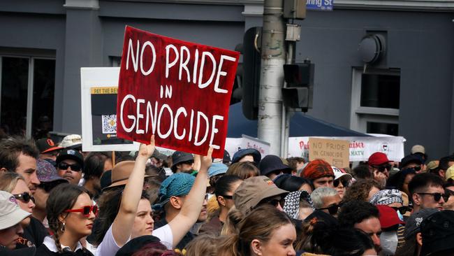 Protesters also carried placards with social messages. Picture: NCA NewsWire / Luis Enrique Ascui