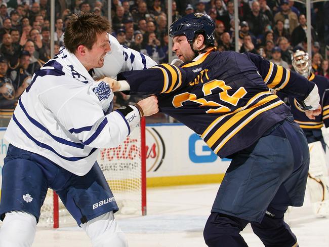 John Scott #32 throws down with Frazer McLaren.