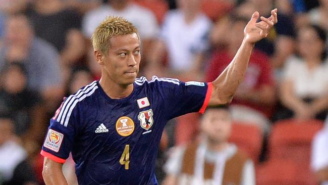 BRISBANE, AUSTRALIA - JANUARY 16: Keisuke Honda of Japan celebrates after scoring a goal during the 2015 Asian Cup match between Iraq and Japan at Suncorp Stadium on January 16, 2015 in Brisbane, Australia. (Photo by Bradley Kanaris/Getty Images)