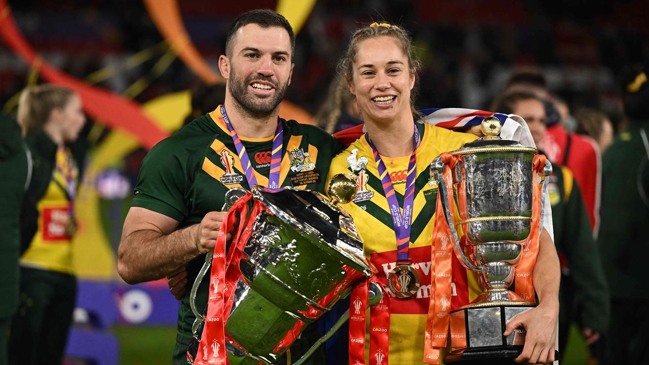 Not a bad day at the office for Australia’s men’s and women’s rugby league teams. (Photo by Oli SCARFF / AFP)