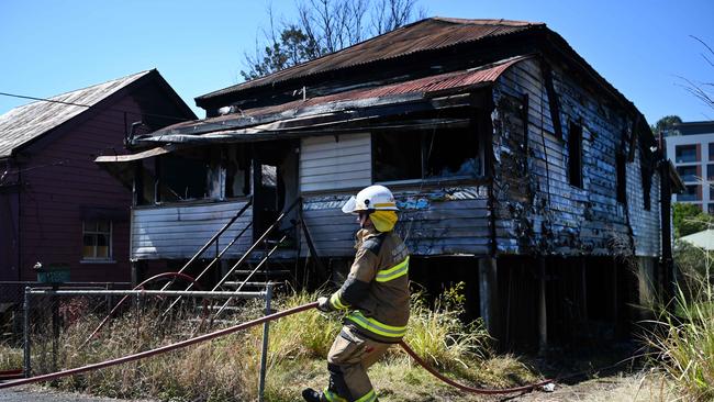 QFES remained on scene to extinguish any spot fires. Picture: Dan Peled / NCA NewsWire