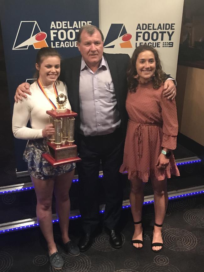 Adelaide University’s Stephanie Walker after winning the 2019 Adelaide Footy League Women's division one best and fairest with Blacks’ coach Mark Moody and teammate Matilda Zander who finished runner up in the medal count. Picture: Supplied