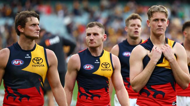 MELBOURNE, AUSTRALIA - JUNE 01: Brayden Cook and his Crows' team mates look dejected after losing the round 12 AFL match between Hawthorn Hawks and Adelaide Crows at Melbourne Cricket Ground, on June 01, 2024, in Melbourne, Australia. (Photo by Quinn Rooney/Getty Images)