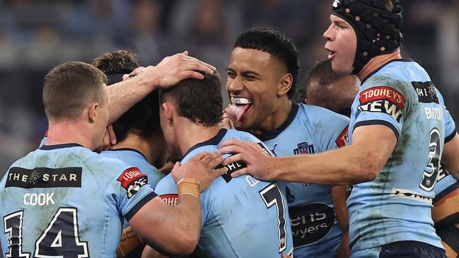 The triumphant Blues celebrate a try (Photo by Paul Kane/Getty Images)