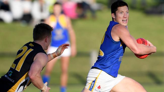 Noble Park’s Jackson Sketcher bursts away from a Balwyn opponent. Picture: Andy Brownbill