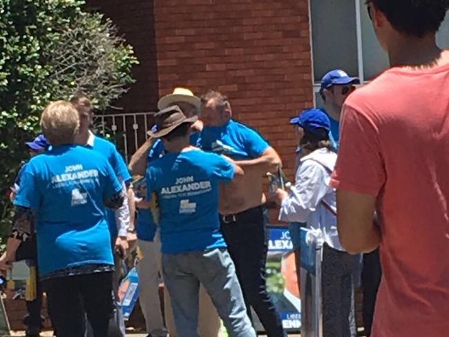 Tony Abbott changes into a Liberal T-shirt at the Epping Church of Christ today. Image supplied