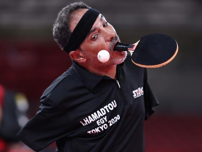 TOKYO, JAPAN - AUGUST 25:  Ibrahim Elhusseiny Hamadtou of Team Egypt competes against Hong Kyu Park of Team Republic of Korea during the Men's Singles Class 6 table tennis match at Tokyo Metropolitan Gymnasium on day 1 of the Tokyo 2020 Paralympic Games on August 25, 2021 in Tokyo, Japan. (Photo by Lintao Zhang/Getty Images)