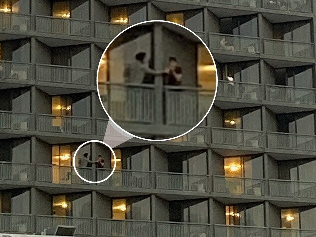 Guests share items between balconies at Brisbane’s Hotel Grand Chancellor.