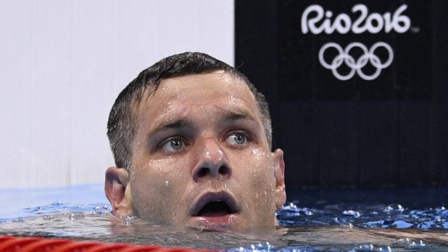 USA's David Plummer is up against Australian Mitch Larkin. Photo: AFP PHOTO/ Martin BUREAU