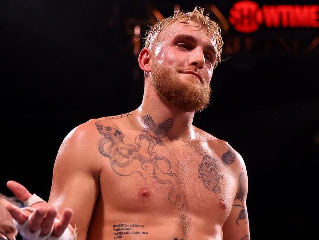 TAMPA, FLORIDA - DECEMBER 18: Jake Paul reacts to knocking out Tyron Woddley in the sixth round during an eight-round cruiserweight bout at the Amalie Arena on December 18, 2021 in Tampa, Florida. (Photo by Mike Ehrmann/Getty Images)