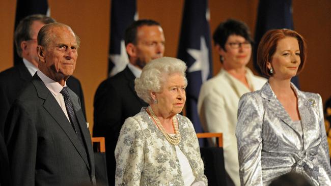 The Queen Elizabeth with Julia Gillard and Tony Abbott when they were prime minister and opposition leader respectively. Picture: AFP Photo / Torsten Blackwood