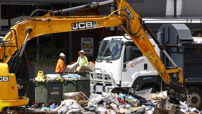 The clean-up continues at Toombul Shopping Centre. Picture: Lachie Millard