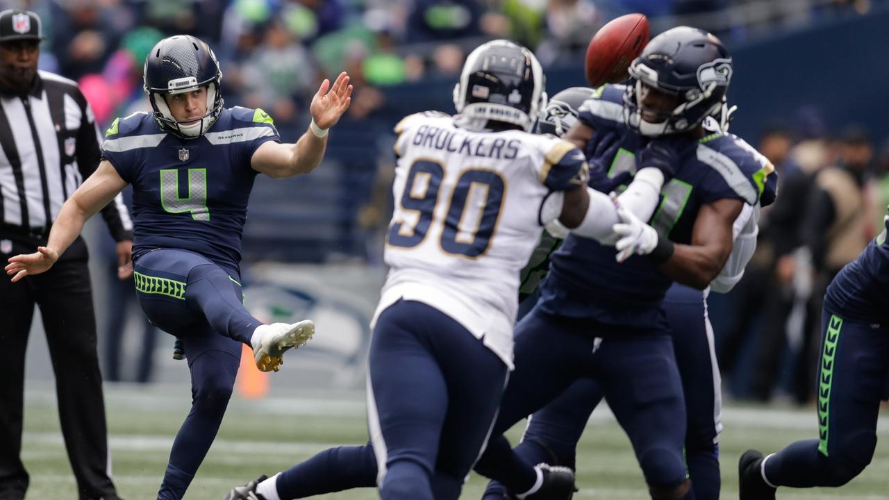 Michael Dickson of the Seattle Seahawks punts the ball during the