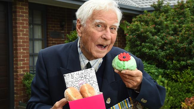 Alan McDonald enjoys his poppy-decorated doughnut at his home in Mornington. Picture: Josie Hayden