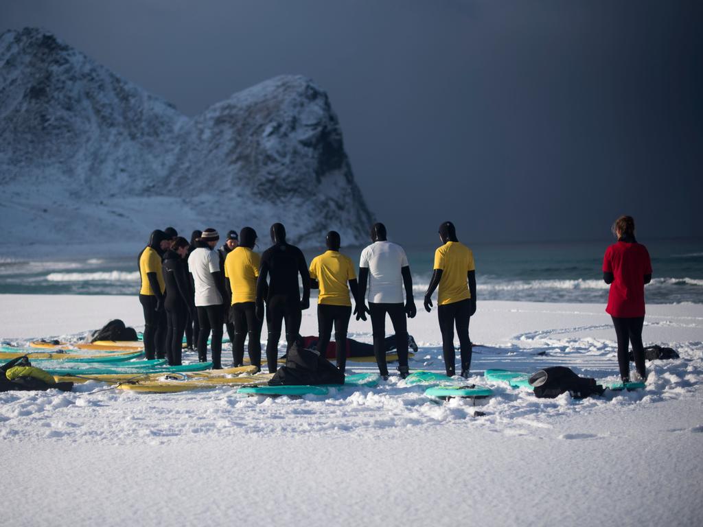 People attend a a surfing lesson on March 11, 2018, in Unstad, northern Norway, Lofoten islands, within the Arctic Circle. Picture: AFP