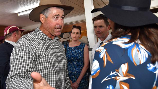 Beef farmer Jim Hancock (left) confronts Premier Annastacia Palaszczuk (right) at the Kumbia Race Club. Picture: AAP/Darren England