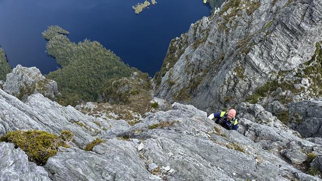 Senior Constable Callum Herbert from Police Search and Rescue on the summit climb to Federation Peak during a recent mission.