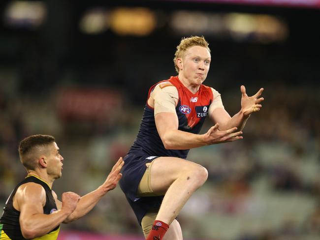 AFL Round 20. 03/08/2019.   Melbourne v Richmond at the MCG.   Melbourne's Clayton Oliver  marks infant of Richmonds Dion Prestia  2nd quarter    .  Pic: Michael Klein