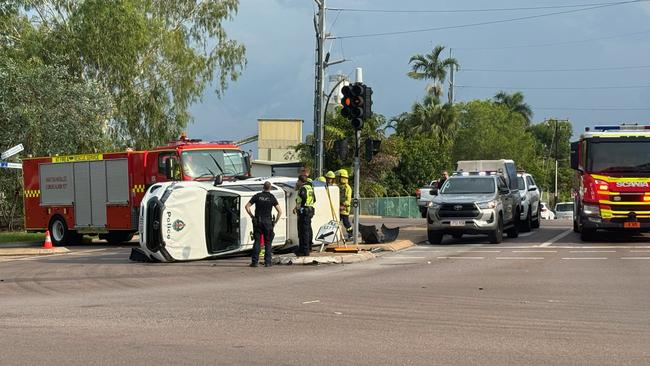 A police vehicle flipped on the corner of Snell Street and the Stuart Highway on Thursday.