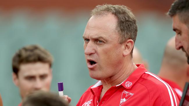 The usually reserved John Longmire was happy to ham it up for the cameras at home this week. Picture: James Elsby (Getty)