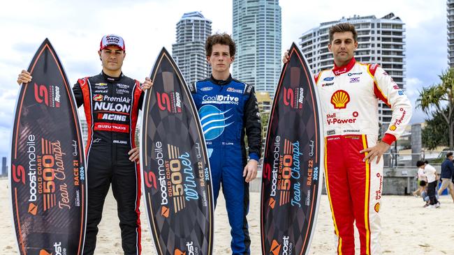 Supercars drivers James Golding, Aaron Love and Andre De Pasquale with the 2024 GC500 trophies on Surfers Paradise beach. Picture: Supplied