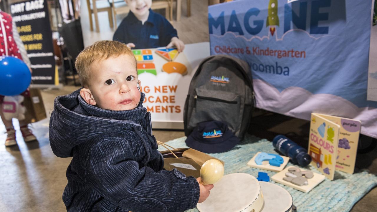 MAKING MUSIC: Euan Baxter checks out the Imagine Childcare and Kindergarten stall. Picture: Kevin Farmer