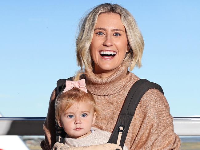 DAILY TELEGRAPH - Pictured at the Virgin Australia Check in at Sydney Domestic Airport today is Julia Carroll with her 1 year old daughter Aurora, who is excited to be travelling again. Picture: Tim Hunter.