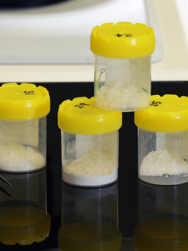 Drug sample containers being analysed by the AFP Forensic team in Canberra. Picture Gary Ramage