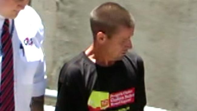 Andrew Hallcroft is led into the Adelaide Magistrates Court soon after his arrest. Picture: Channel 9