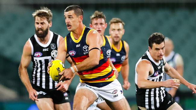 Taylor Walker of the Crows runs with the ball during the round 2 Showdown at Adelaide Oval. Picture: Daniel Kalisz/Getty Images