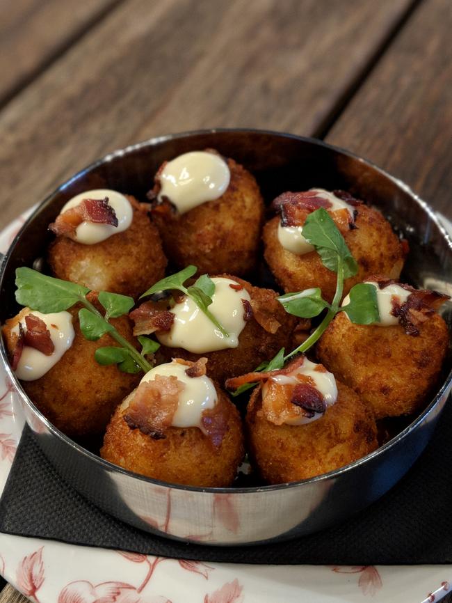 Mac and cheese balls with blue cheese mayo and smoked bacon ($10).