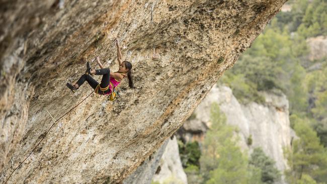 Australian 12-year-old climbing prodigy Angie Scarth-Johnson scales a cliff in Margalef, Spain. Picture: Simon Carter