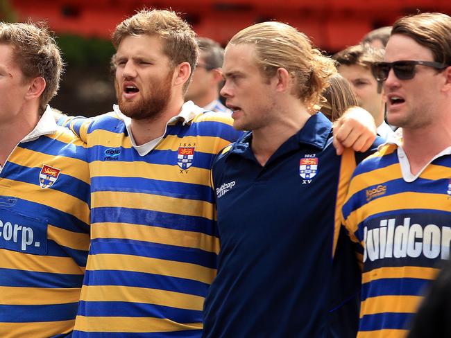 Sydney University players sing the team song at Dan Vickerman's memorial. Picture: Mark Evans