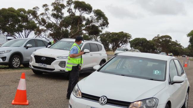 Biosecurity inspection officers are searching cars at the border. Picture: Arj Ganesan