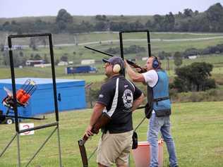 CLUB ON TARGET: Peter Shepherd watches while Nathan Gordon takes aim at the Richmond River Gun Club's inaugural Star Car Rental Five Stand Summer Series at the Wyrallah Rd range. Picture: Alison Paterson