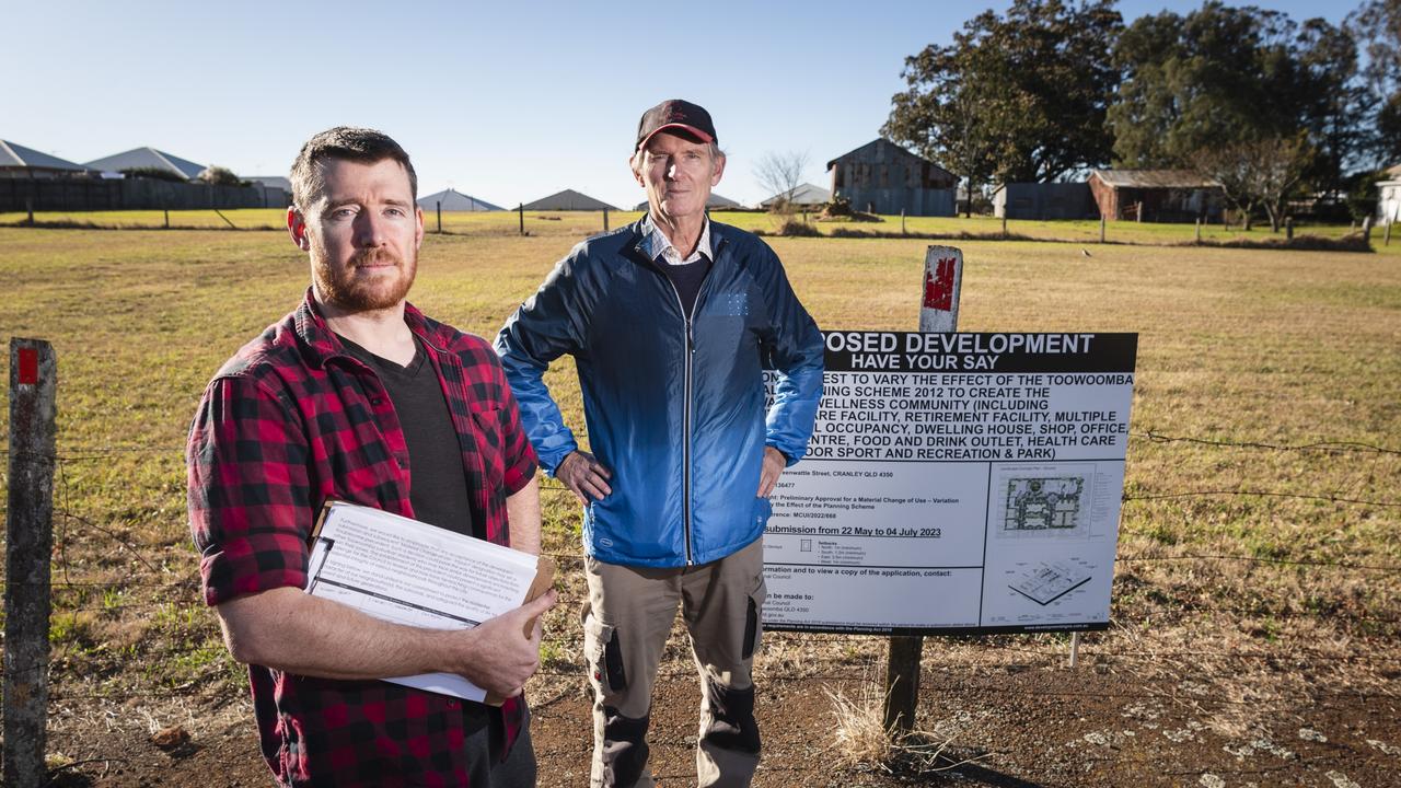 John Bryant (left) and Ian Basset after a community meeting at Halsworth Street Park opposing proposed material change of use to create the Greenwattle Wellness Community development on Greenwattle St, Saturday, June 24, 2023. Picture: Kevin Farmer