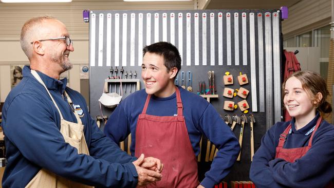 WEEKEND TELEGRAPHS. Head teacher of industrial arts at Corrimal High School Craig Mulder, with year 11 students Cullen Hoyn and Avalon Mooney in the schoolÃs brand new industrial arts building which replaces one which burnt down in 2018. Friday 03/05/2024. Picture by Max Mason-Hubers