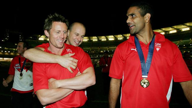 Matthew Nicks hugs Stuart Maxfield after Sydney’s 2005 grand final win, which Nicks missed with injury.