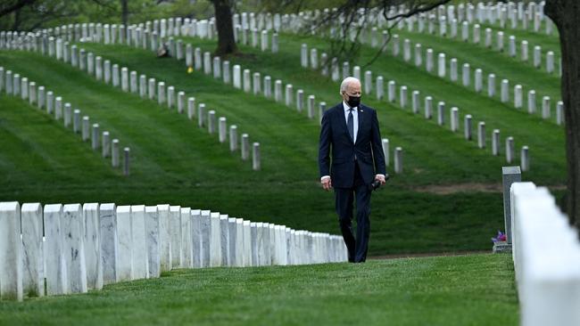 President Joe Biden walks through Arlington National Cemetery to honour fallen veterans of the Afghan conflict. Picture: AFP