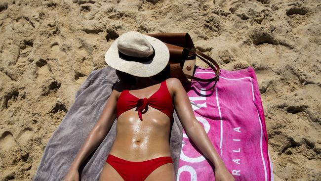 SYDNEY, AUSTRALIA - NewsWire Photos JANUARY 23, 2021: A women is seen with a hat shading her face from the sun at Coogee Beach. Picture: NCA NewsWire / Jenny Evans