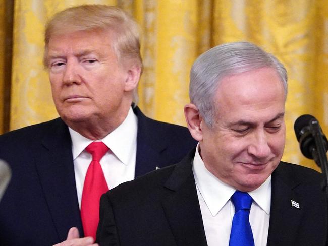 (FILES) US President Donald Trump and Israeli Prime Minister Benjamin Netanyahu take part in an announcement of Trump's Middle East peace plan in the East Room of the White House in Washington, DC on January 28, 2020. In a choice between Kamala Harris and Donald Trump for US president, Israeli Prime Minister Benjamin Netanyahu will likely be hoping that the man with whom he has a close relationship and who delivered multiple diplomatic victories for Israel, will triumph. (Photo by MANDEL NGAN / AFP)