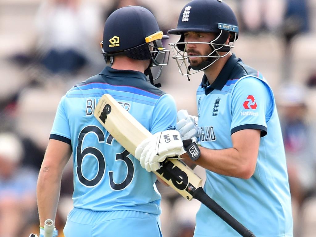 England's James Vince congratulates England's Jos Buttler on a half-century against Australia.