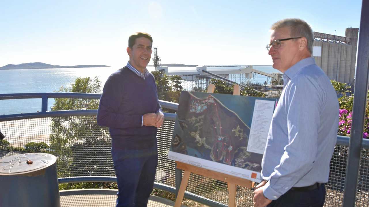 MINISTER'S CALL: Cameron Dick and Richard Austin with a map of the proposed development on Hummock Hill. Picture: Greg Bray