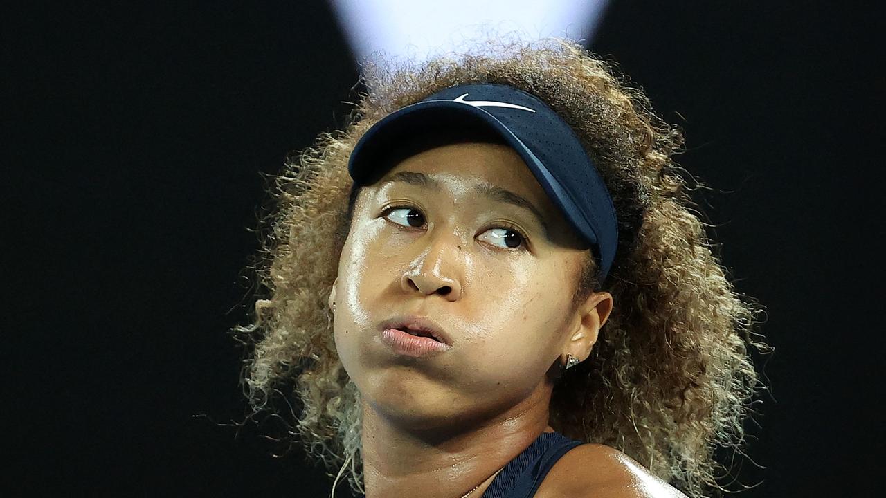 (FILES) This file photo taken on February 20, 2021 shows Japan's tennis player Naomi Osaka reacting on a point against Jennifer Brady of the US during their women's singles final match on day thirteen of the Australian Open tennis tournament in Melbourne. - Naomi Osaka has pulled out of Berlin WTA grasscourt tournament in the wake of her controversial exit from the French Open, organisers confirmed on June 7, 2021. (Photo by David Gray / AFP) / -- IMAGE RESTRICTED TO EDITORIAL USE - STRICTLY NO COMMERCIAL USE --