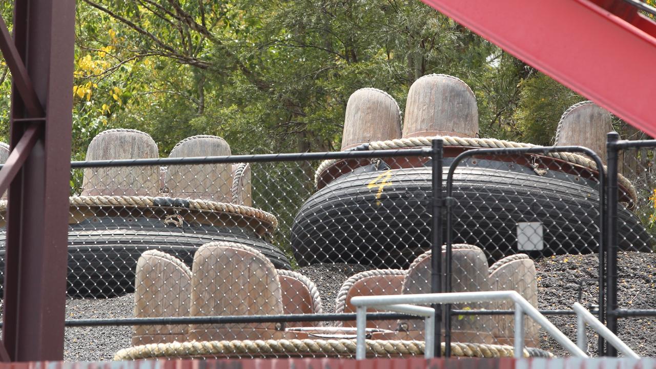 Ride carriages sat in a group at Dreamworld in 2016, as investigations continued into the fatal accident. Picture: Jono Searle.